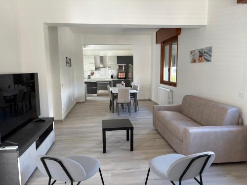 a living room with a couch and a table at Tominettihome in Verbania