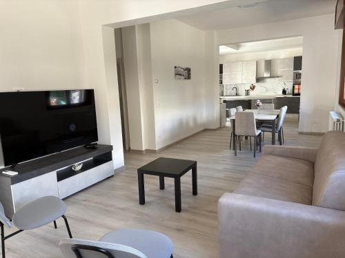 a living room with a couch and a table at Tominettihome in Verbania