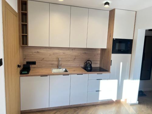 Η κουζίνα ή μικρή κουζίνα στο Apartament Wiosełko
