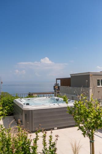 a hot tub on the roof of a building at Kempinski Villa 100m from Beach in Savudrija