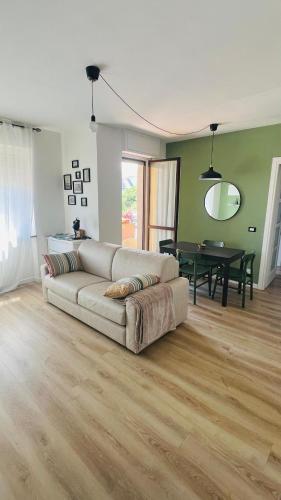 a living room with a couch and a table at La Dimora di Borgo in Borgo San Dalmazzo