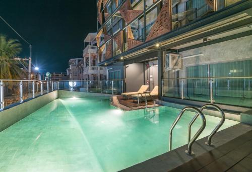 a swimming pool on top of a building at night at Sea Crest by Jomtien in Jomtien Beach