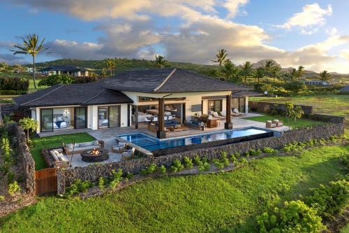 an aerial view of a house with a pool at Ke Kai Nui at Kukuiula in Koloa