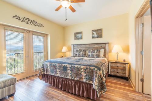 a bedroom with a bed and a ceiling fan at Mountain View Condo 3702 in Pigeon Forge