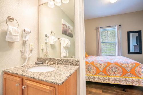 a bathroom with a sink and a bed at Mountain View Condo 3307 in Pigeon Forge