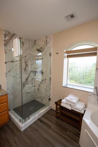 a bathroom with a shower with a glass door at Mountain View Condo 1501 in Pigeon Forge