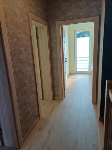 an empty room with a hallway with two doors at Willa Przygoda in Żukowo