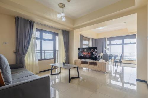 a living room with a couch and a table at The Radiance Manila Bay in Manila
