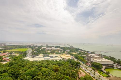 an overhead view of a city with trees and water at The Radiance Manila Bay in Manila