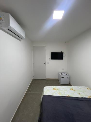Ένα ή περισσότερα κρεβάτια σε δωμάτιο στο Manaira Suite 01