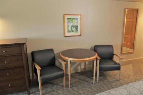 a table and two chairs in a room at Silver Bay YMCA Inn and Conference Center in Silver Bay