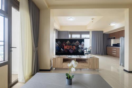 a living room with a flat screen tv at The Radiance Manila Bay in Manila