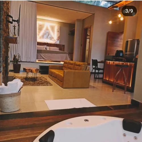 Posezení v ubytování Loft das Bromélias