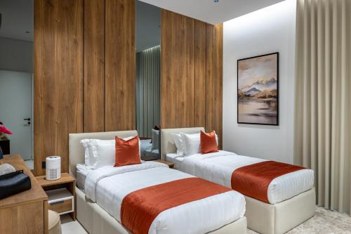 Ένα ή περισσότερα κρεβάτια σε δωμάτιο στο Yasmin Homes - Luxury Apartments