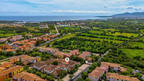 an aerial view of a town with houses and the ocean at Altair in Agrustos