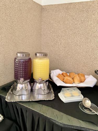 a table topped with a table with food on it at Hotel Avenida Bauru in Bauru