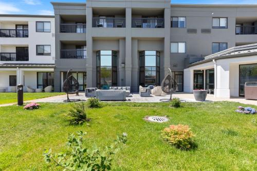 an apartment building with a lawn in front of it at Best Western Plus Elgin - Chicago in West Dundee