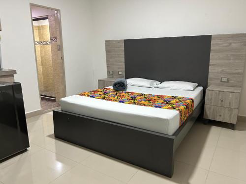 Postel nebo postele na pokoji v ubytování Hotel Ciento Once Boutique Laureles