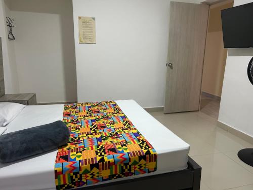 Postel nebo postele na pokoji v ubytování Hotel Ciento Once Boutique Laureles