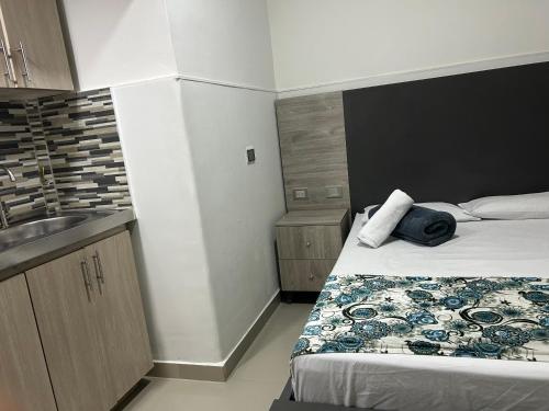 Postel nebo postele na pokoji v ubytování Hotel Ciento Once Boutique Laureles