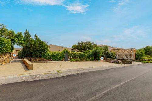an empty street with a house in the background at Altair in Agrustos