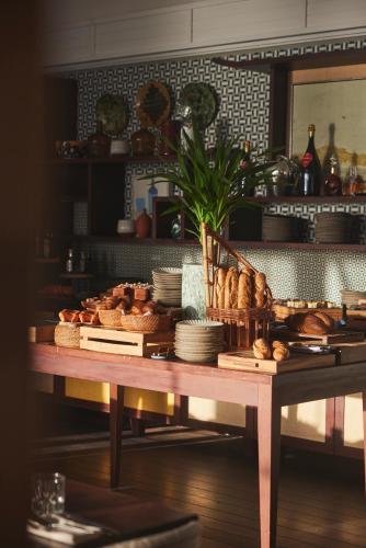 a table with bread and other foods on it at Rosewood Le Guanahani St Barth in Marigot