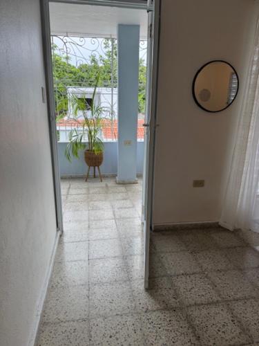 an empty hallway with a mirror and a mirror at Escape to Calm Quiet Bliss in Humacao