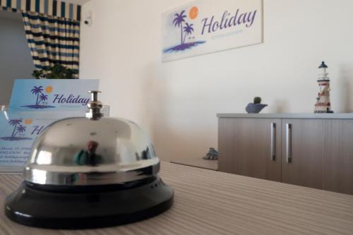a silver object sitting on top of a table at Holiday Affittacamere in Corigliano Calabro