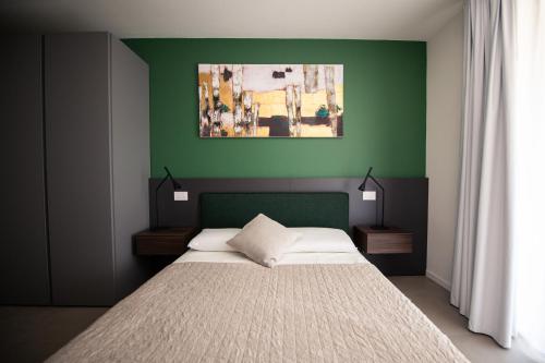 Postel nebo postele na pokoji v ubytování Corte Brunati Villetta Prestige