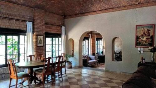 a living room with a table and chairs at Casona María Esther in San Miguel de Allende