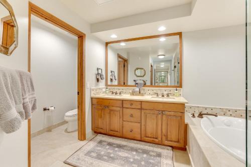 a bathroom with a tub and a toilet and a sink at Half-Mi to Payette Lake Dtwn McCall Condo! in McCall