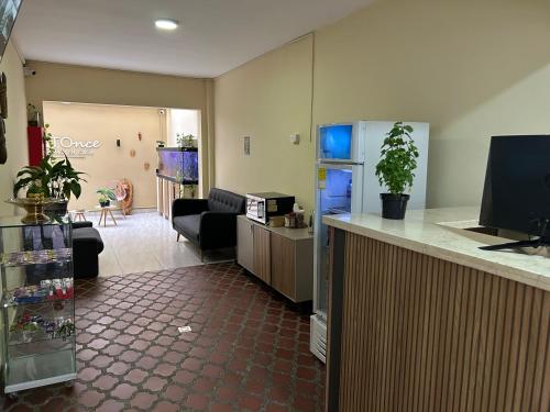 TV a/nebo společenská místnost v ubytování Hotel Ciento Once Boutique Laureles