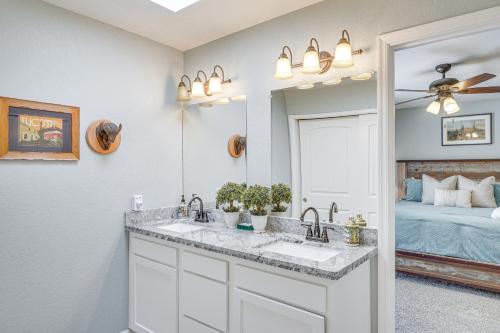 a bathroom with a sink and a mirror at Bear Canyon Casa - Tucson Home Base with Mtn Views in Tucson