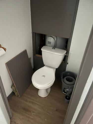 a small bathroom with a toilet in a stall at Le grand argentier - valfrejus in Modane