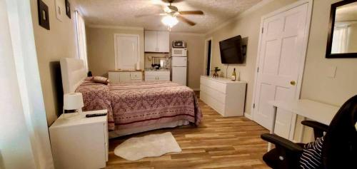 Ένα ή περισσότερα κρεβάτια σε δωμάτιο στο Woodland Apartments