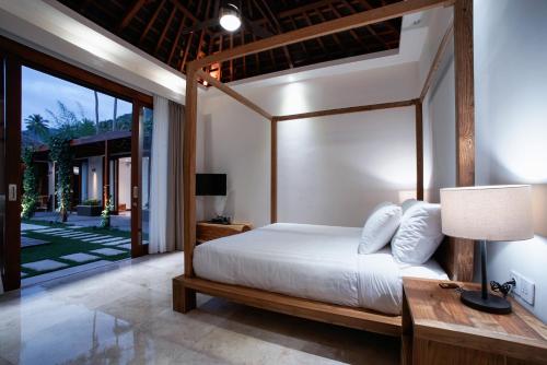 Ένα ή περισσότερα κρεβάτια σε δωμάτιο στο Bale Mandala Villas