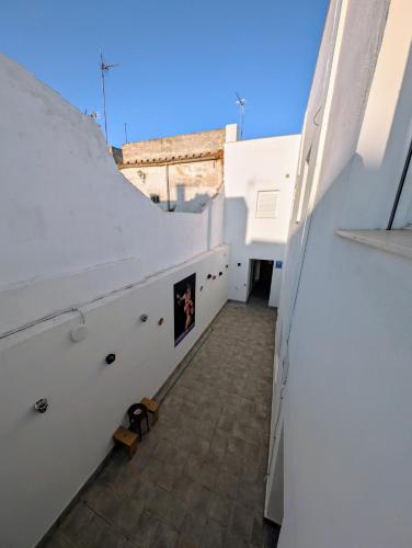 a view from the balcony of a building with white walls at A Jerez Apartamentos in Jerez de la Frontera