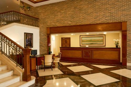 a lobby with a staircase and a stair case at JW Marriott Caracas in Caracas