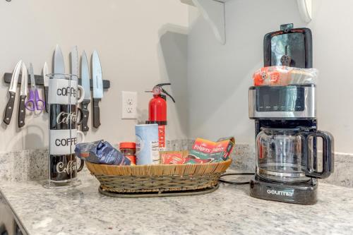 a kitchen counter with a basket of food and a blender at 1 Mi to Conway Riverwalk Studio in Historic Dtwn in Conway