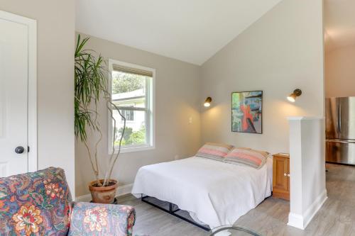 a bedroom with a bed and a chair at 1 Mi to Conway Riverwalk Studio in Historic Dtwn in Conway