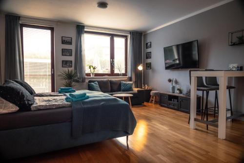 Una televisión o centro de entretenimiento en Apartment Čeladná