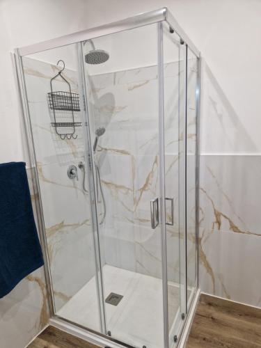 a shower with a glass enclosure in a bathroom at ITALO b&b in Raiano