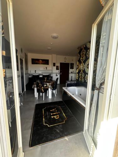 a living room with a bath tub and a dining room at La Casa Dei Sogni in Lanuvio