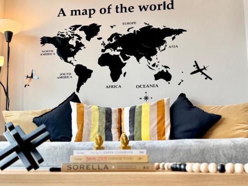 a map of the world wall sticker in a living room at Elegant, Comfy & Sophisticated MetroLux Downtown Suite in Calgary