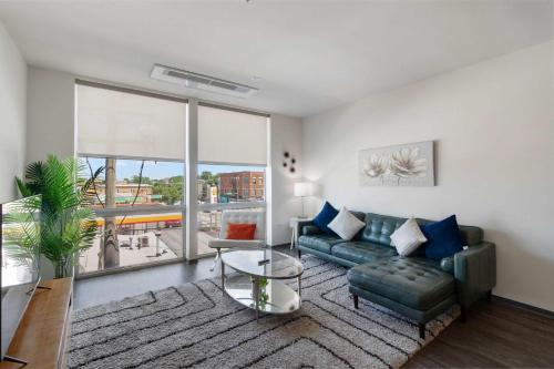 a living room with a couch and a table at New Modern 1BR Lux City Escape in Chicago