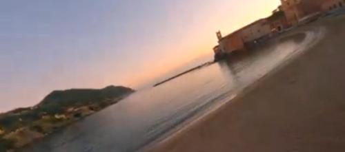 a blurry picture of a beach with a body of water at Sunflower in Tavarone