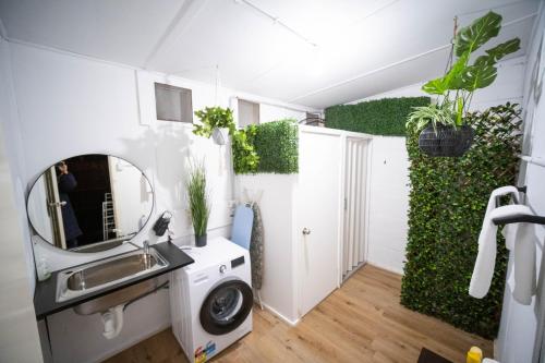 a bathroom with a sink and a mirror at MP Beach Club in Tootgarook