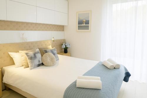 Ένα ή περισσότερα κρεβάτια σε δωμάτιο στο Blue Seaside Apartment