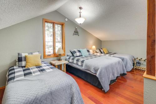 a bedroom with two beds and a window at Families Welcome Quiet Cabin Less Than 5 Mi to Cloudcroft in Cloudcroft