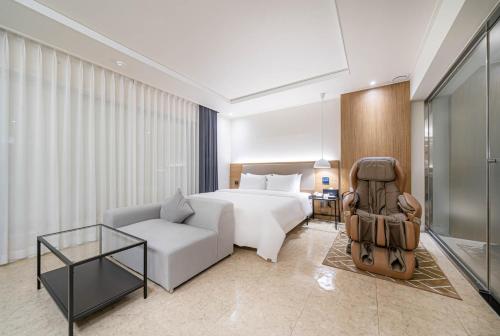 Ένα ή περισσότερα κρεβάτια σε δωμάτιο στο Hotel Foma